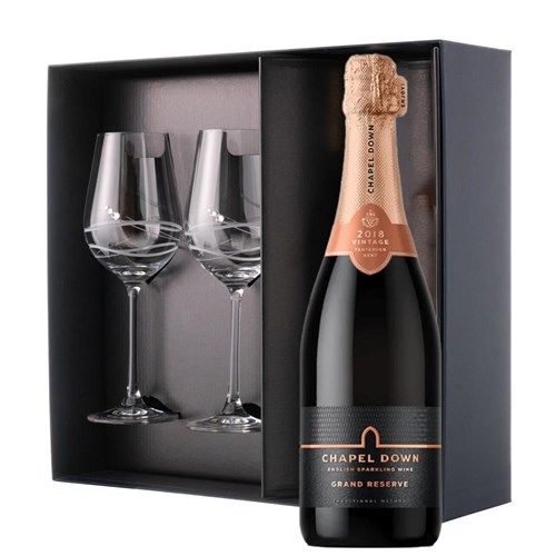 This luxurious gift set is the perfect choice for those who appreciate fine sparkling wine and refined glassware. Featuring a bottle of Chapel Down Grand Reserve Brut English Sparkling 75cl paired with two exquisite Venezia Glasses adorned with Swarovski Crystals, this set is beautifully presente